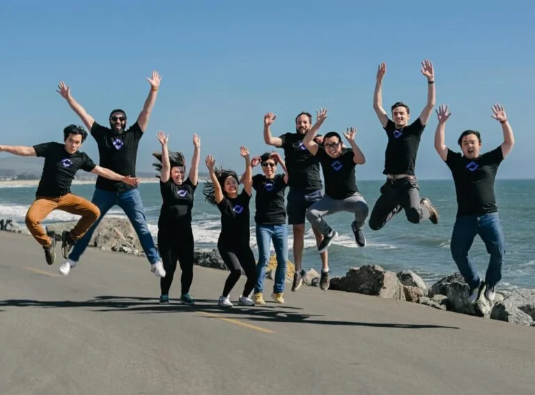 Kolena team celebrating at the beach